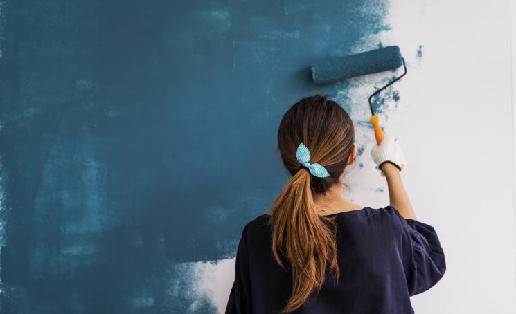 Young,Asian,Happy,Woman,Painting,Interior,Wall,With,Paint,Roller