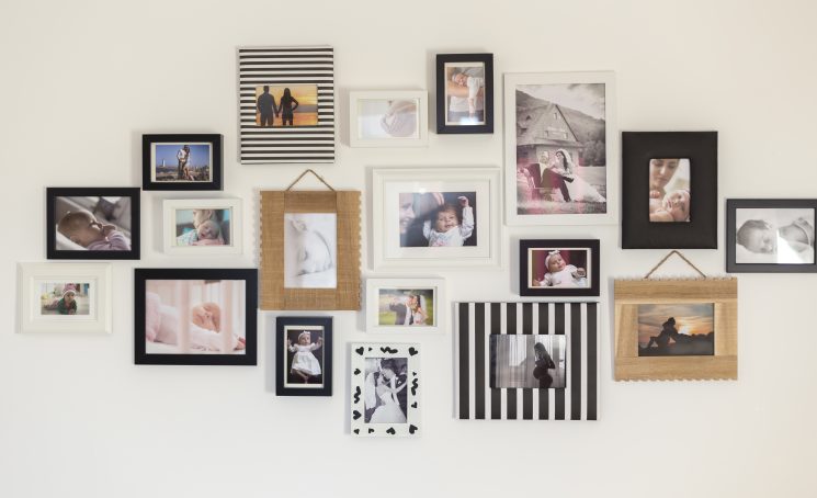 White,Wall,With,Photos,Of,The,Family,In,Various,Photo