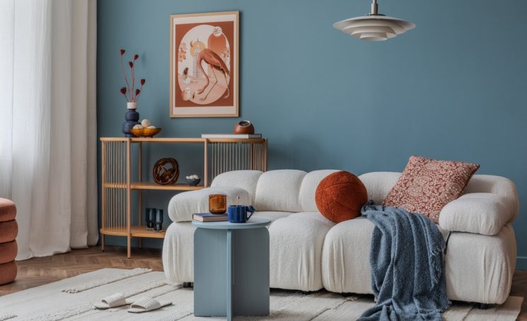 Cozy,Boucle,Sofa,Against,A,Deep,Blue,Wall,,Styled,With